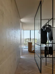 Modern interior design featuring a combination of wood and concrete materials, showcasing contemporary and minimalist aesthet