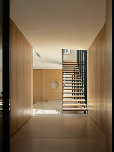 Modern interior design featuring wood, metal, and concrete materials