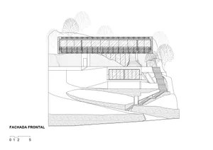 A modern architectural exterior featuring a steel structure with concrete stairs.