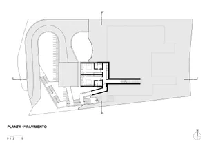 A technical drawing of a modern house's first floor plan showing rooms and spatial layout.