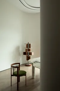 A modern interior design featuring wooden furniture and metallic accents.