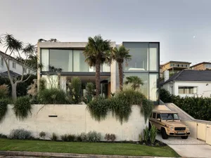 Modern residential home with concrete and glass facade
