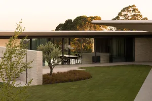 Modern residential interior design featuring extensive use of glass.