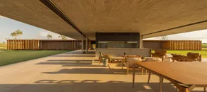 Modern patio area with wooden furniture and concrete floor, featuring a minimalist design.