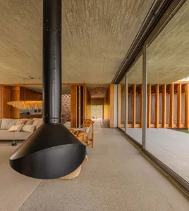 Modern living area with concrete flooring and seating