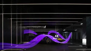 A sleek, modern car with futuristic design features and a metallic finish.