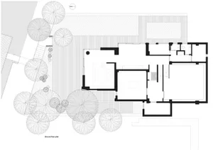 Modern residential house with a ground floor plan featuring open living space, bedrooms, bathrooms, and outdoor deck.