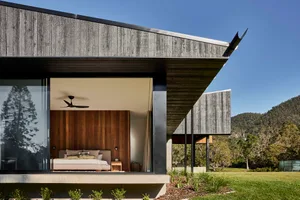 A modern residential interior featuring exposed wood elements.