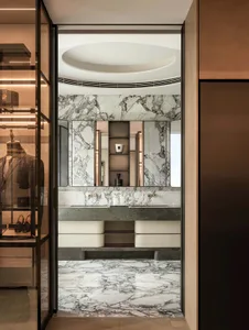 Modern closet with marble walls and floor.