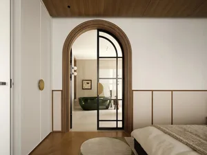 A modern bedroom featuring an elegant arched door with a glass panel and wooden elements.
