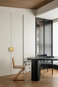 A modern living room featuring wood and concrete elements.