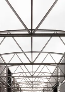 Metal roof frame structure viewed from below.