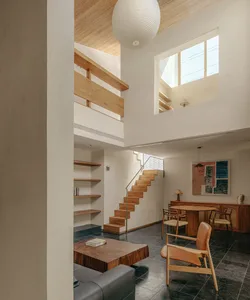 A modern residential living room featuring wooden accents and open-plan design.