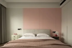 A modern minimalist bedroom with textured fabric bedding and a pink accent wall.