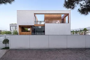 Modern house exterior with concrete walls and wooden accents