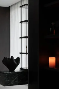 Modern residential interior featuring minimalist concrete furniture.