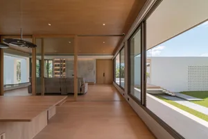 Contemporary living room featuring wooden tiles and minimalist design.