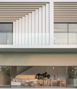 A modern residential building with a contemporary design featuring large glass windows and geometric patterns on the facade.