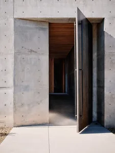 Concrete entrance with wooden accents