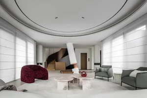Modern interior design featuring marble furniture and circular ceiling.