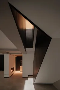 Modern interior design featuring metallic corners and sleek architectural elements.