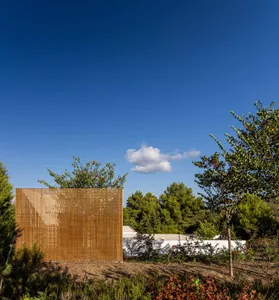 A minimalist architectural window design featuring a wooden lattice frame.