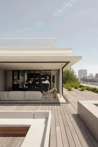 A modern minimalist residential terrace featuring a combination of concrete and wood materials.