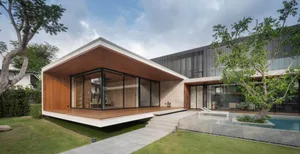 A modern house with a pool and garden