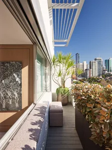 Modern design apartment featuring wooden flooring, cityscape view, and urban elements.