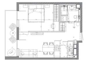 Floor plan of a modern apartment layout with bedroom, kitchen, and living room.