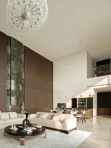 Modern living room and dining area with marble accents and wooden elements