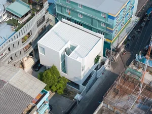Modern building with a concrete exterior and a unique architectural design.