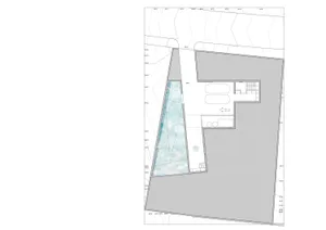 An overhead view of a modern residential floor plan featuring a glass wall.
