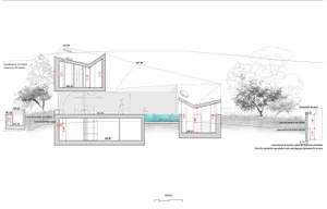 Sectional drawing of a modern house featuring concrete materials and architectural details.