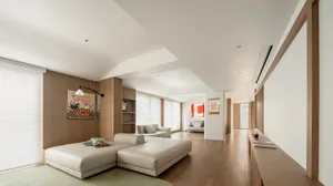 Modern living room featuring wood paneling and contemporary furniture.