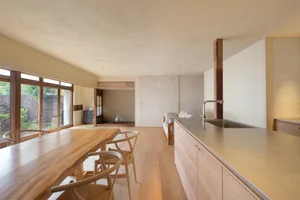 Modern residential kitchen featuring wooden elements and minimalistic design.
