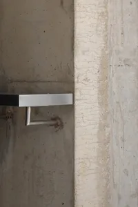 Concrete wall and floor details with minimalist design features.