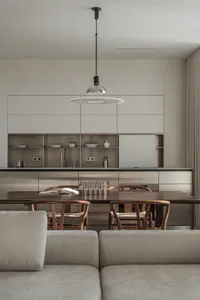 Modern kitchen with metallic and wooden furniture, minimalist design, and open shelving.