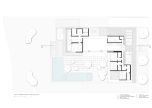 Floor plan of a modern residential building with concrete features and a minimalist aesthetic.