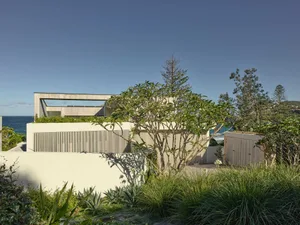 A modern residential building with concrete and wood architectural elements