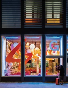 A retail storefront display featuring industrial-style lighting and decor.