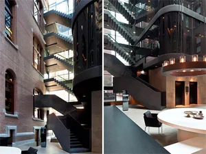 An image showing a modern lobby with metal stairs.