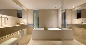 Modern bathroom featuring a minimalist design with a large freestanding bathtub made of marble.
