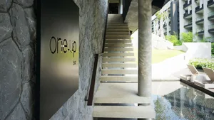 Modern commercial interior design featuring stone cladding and concrete materials