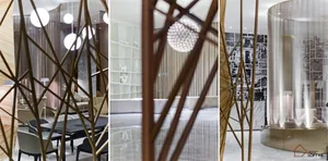 A modern hotel lobby featuring metallic structural elements and contemporary design.