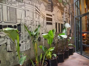 Urban industrial restaurant interior with concrete walls and glass accents