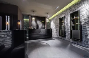 Modern industrial-style office reception area with mixed materials