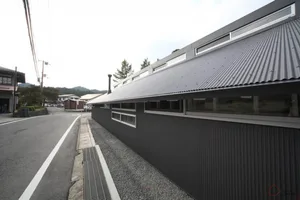A modern office building with a concrete exterior.