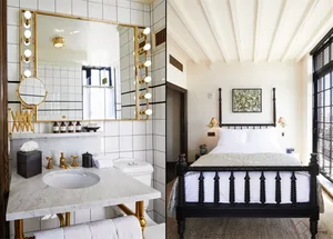A bedroom with a black bed frame and white walls, featuring a window and a minimalist design.