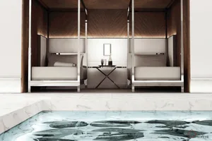 A modern hot tub suite featuring marble and concrete materials